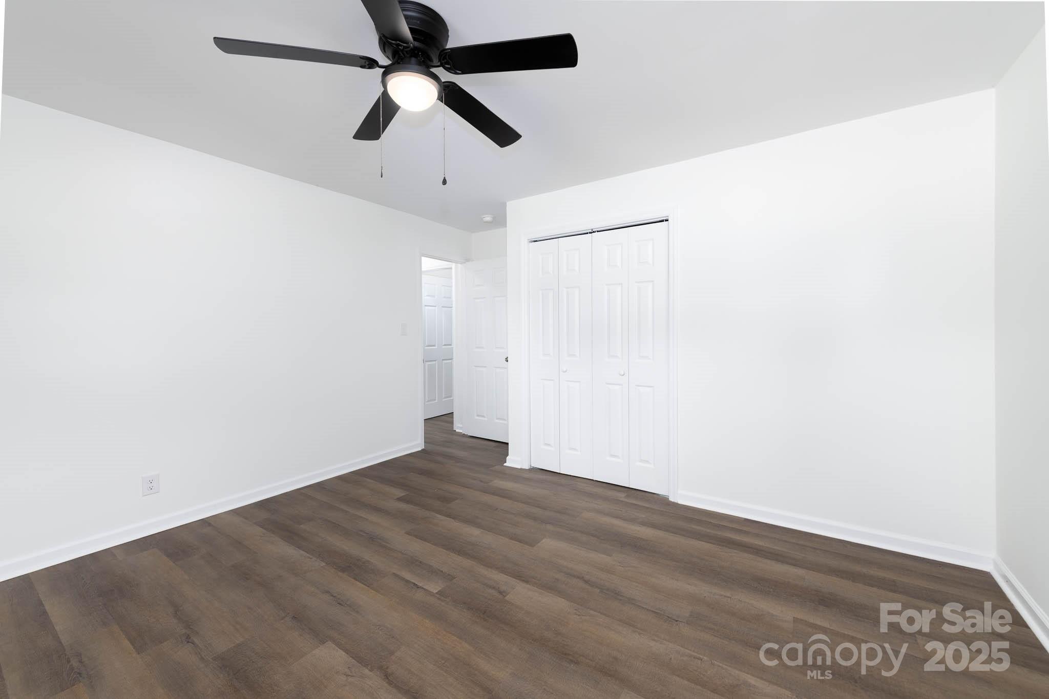108 South Little Texas Road Kannapolis, NC 28083 - Photo 16 of 24 an empty room with a ceiling fan and a window