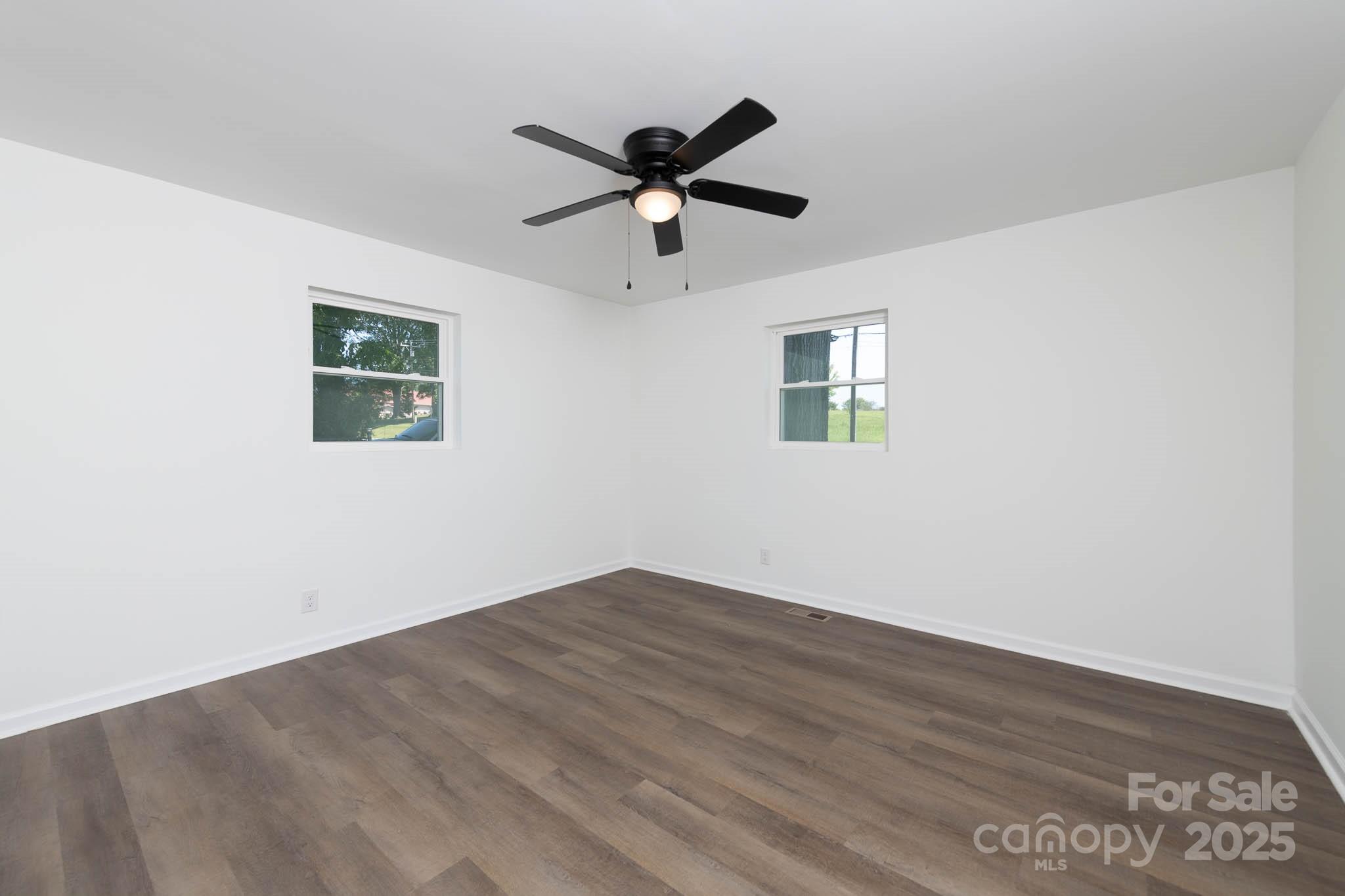 108 South Little Texas Road Kannapolis, NC 28083 - Photo 17 of 24 a view of empty room with wooden floor and ceiling fan