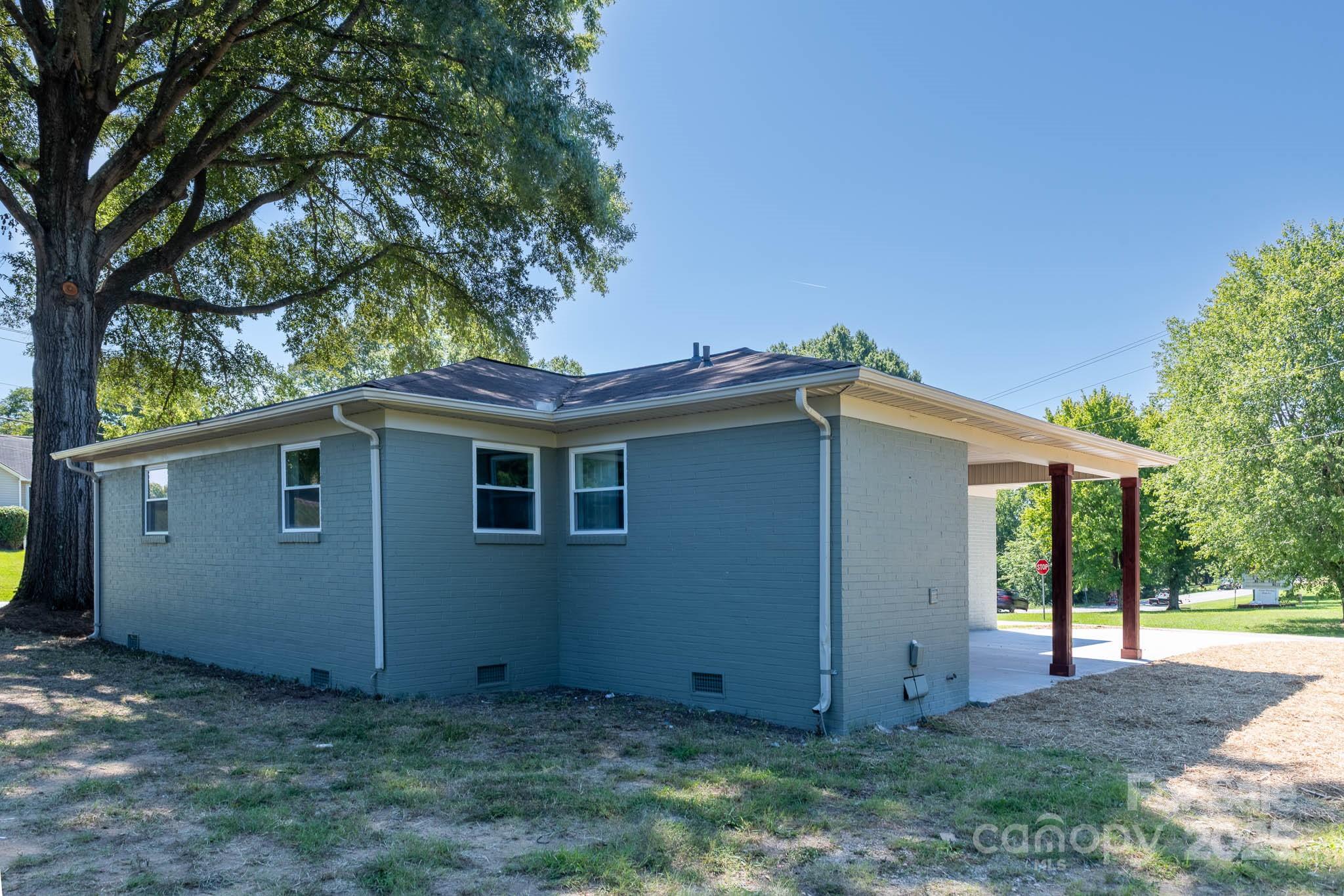 108 South Little Texas Road Kannapolis, NC 28083 - Photo 20 of 24 a view of a house with a yard and large tree
