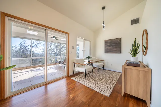 a kitchen with stainless steel appliances kitchen island granite countertop a sink dishwasher stove and cabinets