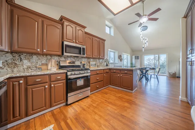 a spacious bedroom with a large bed and a couch