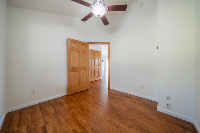 a spacious bathroom with a granite countertop sink and a mirror