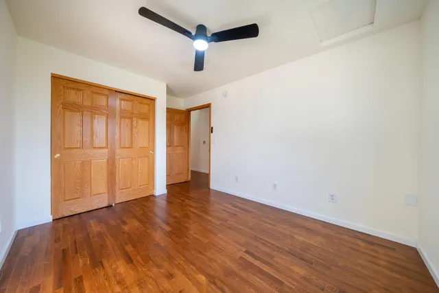 a view of kitchen with livingroom and wooden floor