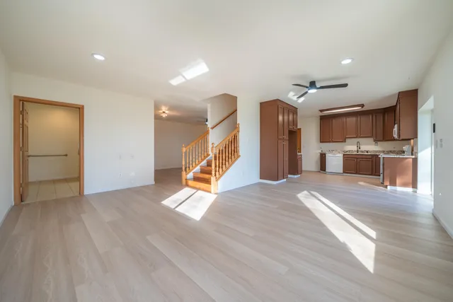 a kitchen with stainless steel appliances granite countertop a refrigerator sink and cabinets