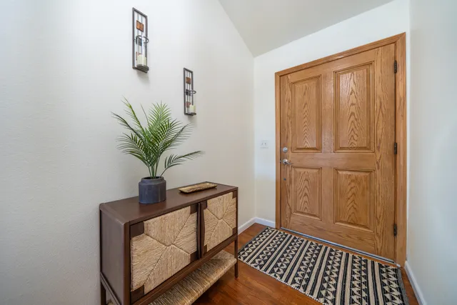 a view of entryway with wooden floor