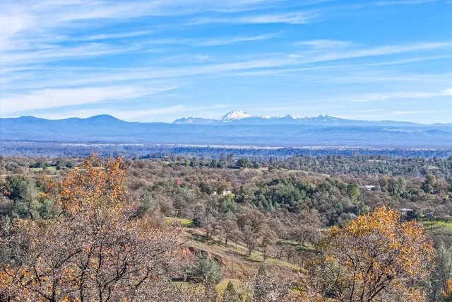 a view of a city with mountains in the background