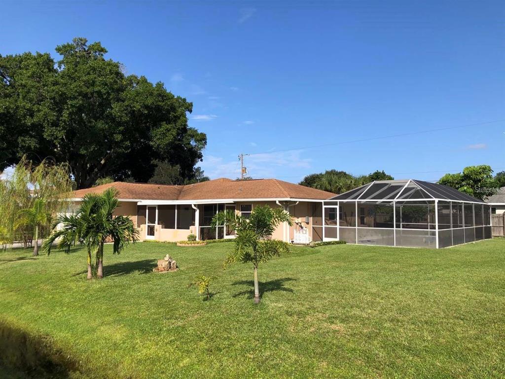 596 Carmel Road Venice, FL 34293 - Photo 1 of 1 a front view of a house with a yard