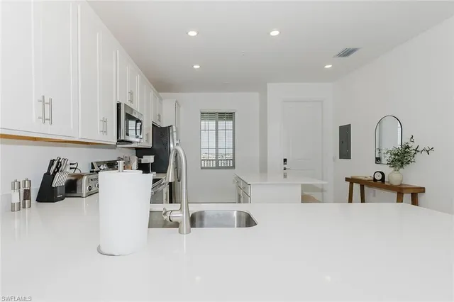 a kitchen with cabinets and a sink