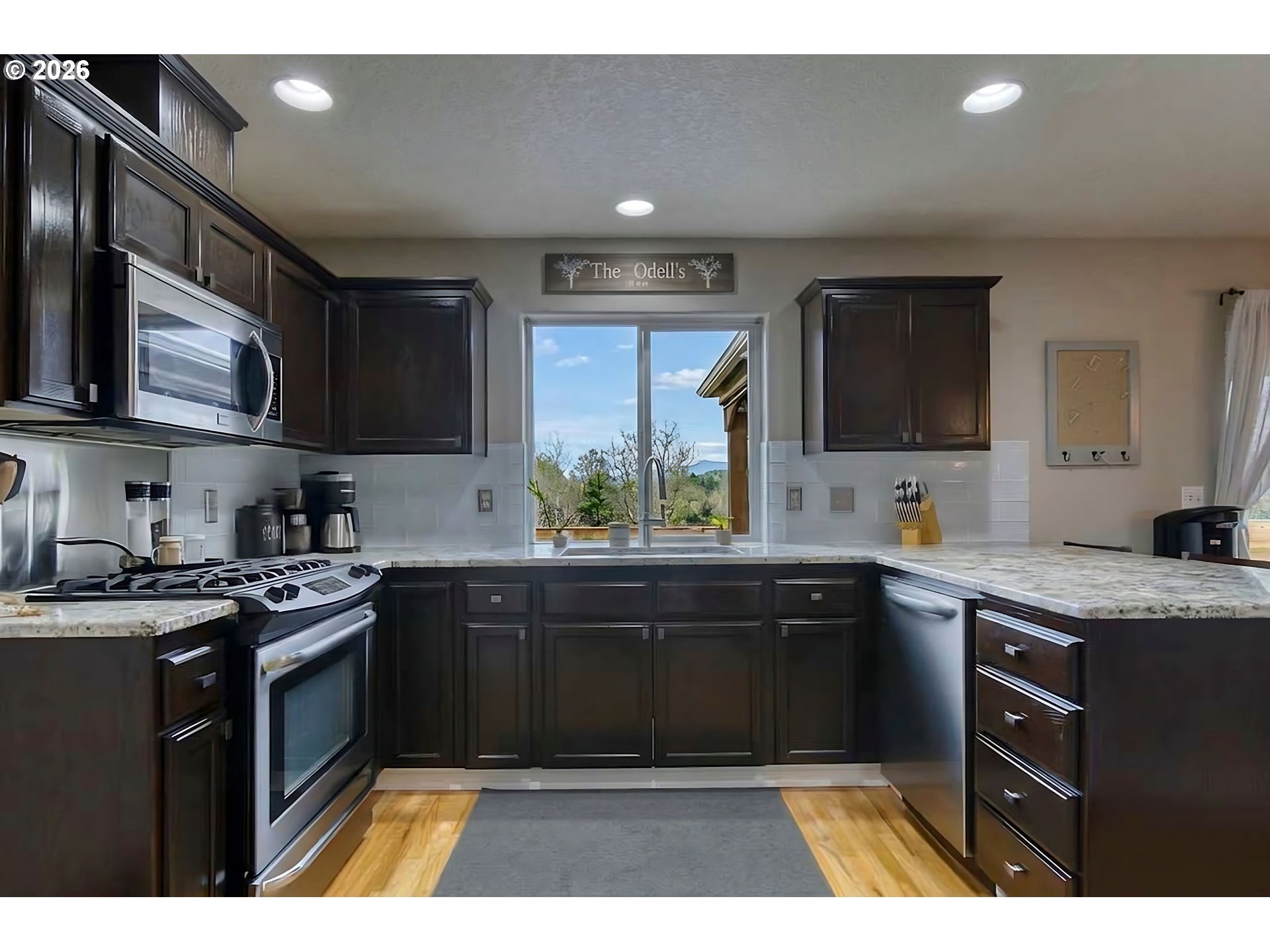 59016 Timberline Avenue St. Helens, OR 97051 - Photo 16 of 36 a kitchen with a sink stove and microwave