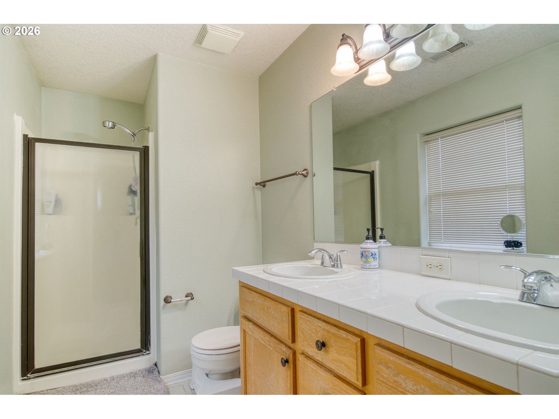 59016 Timberline Avenue St. Helens, OR 97051 - Photo 19 of 36 a bathroom with a sink a toilet and shower