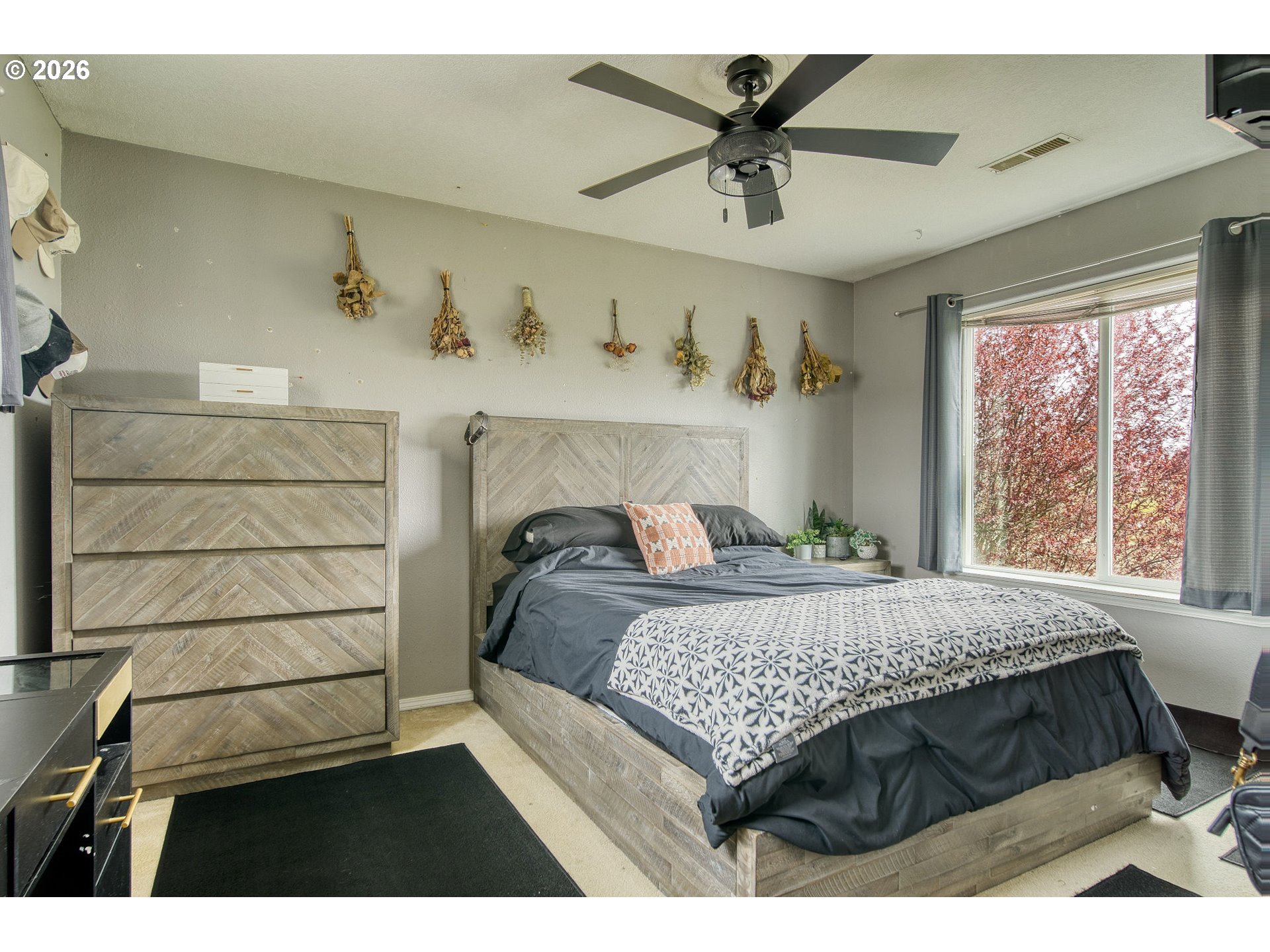 59016 Timberline Avenue St. Helens, OR 97051 - Photo 20 of 36 a bedroom with a bed a window and a chandelier