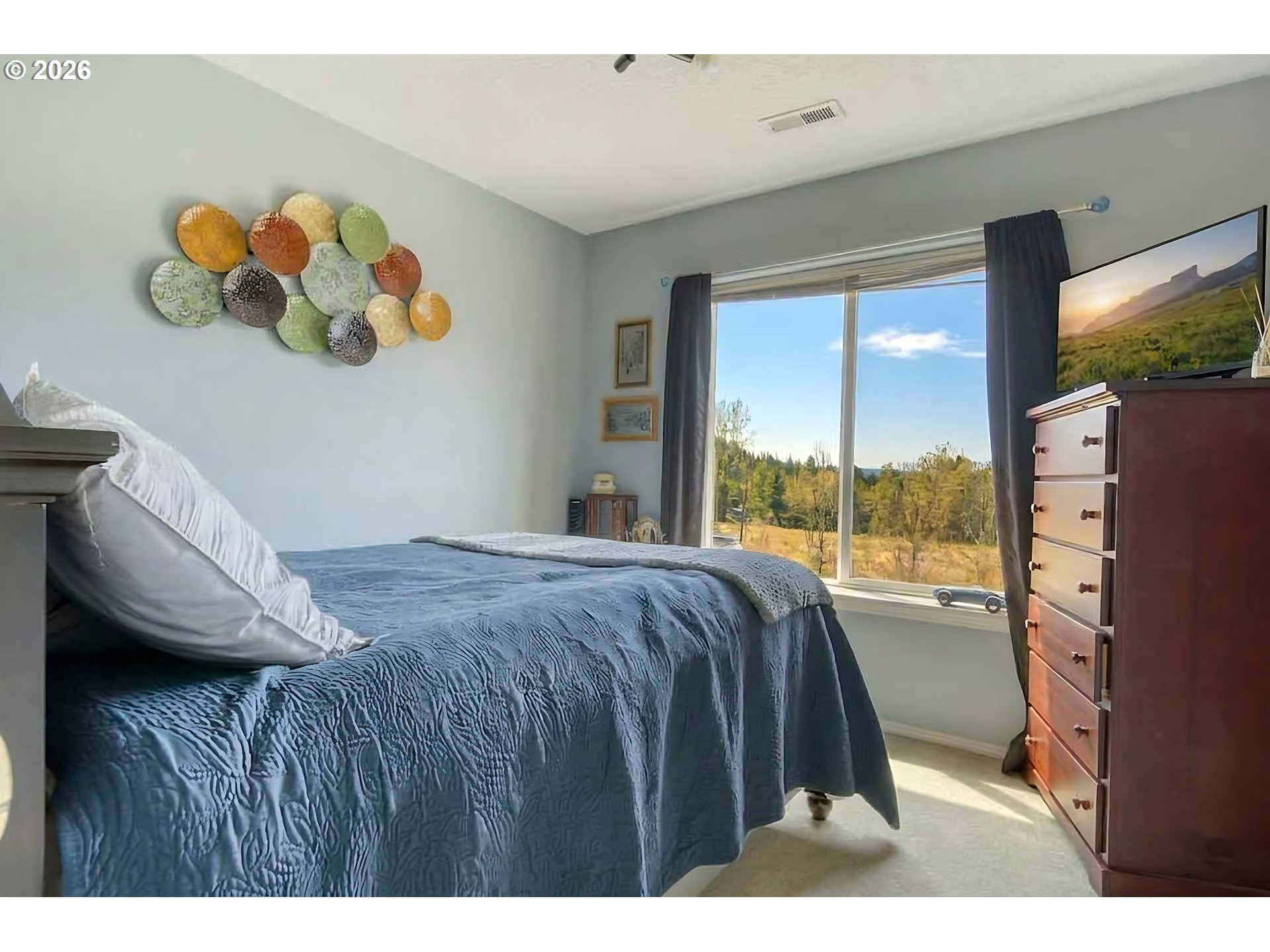 59016 Timberline Avenue St. Helens, OR 97051 - Photo 23 of 36 a bedroom with a bed and a window