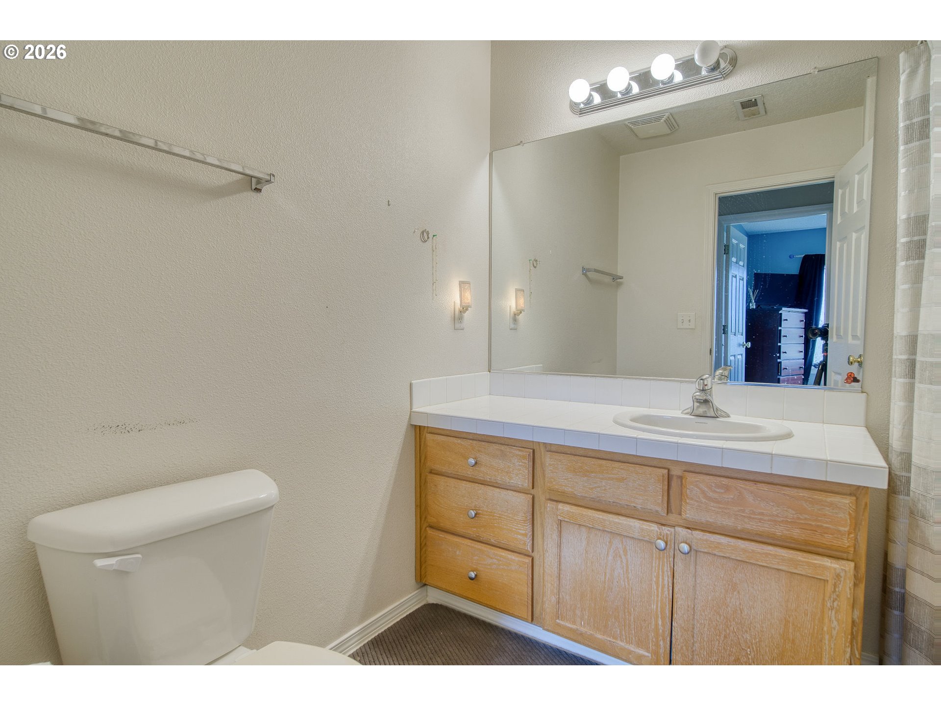 59016 Timberline Avenue St. Helens, OR 97051 - Photo 26 of 36 a bathroom with a sink a toilet a mirror and vanity