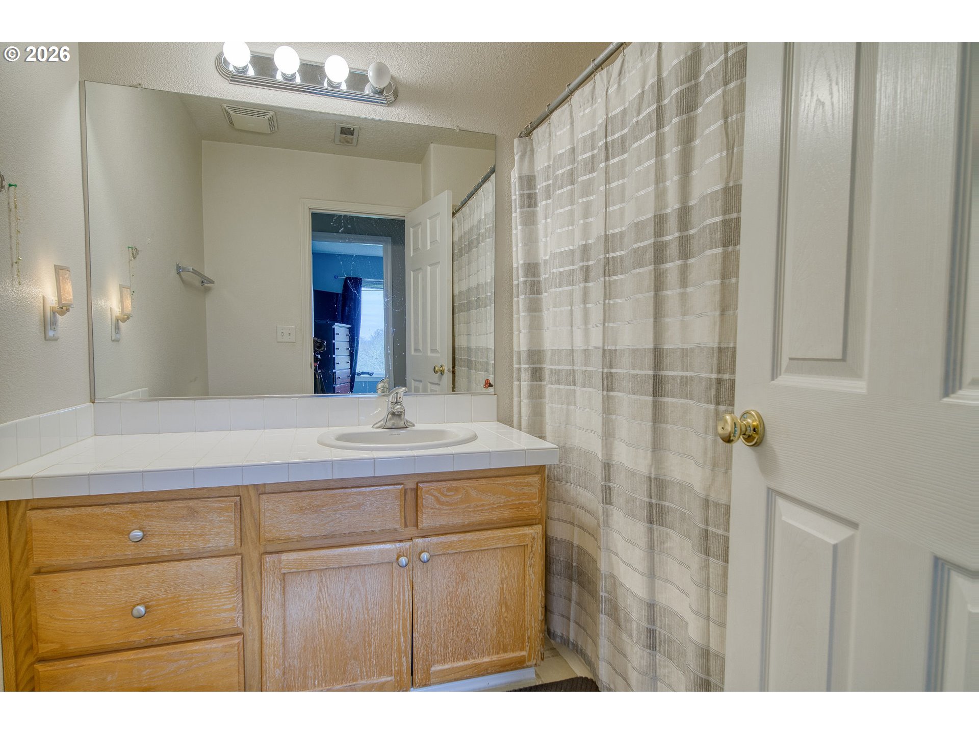 59016 Timberline Avenue St. Helens, OR 97051 - Photo 27 of 36 a bathroom with a sink and a mirror