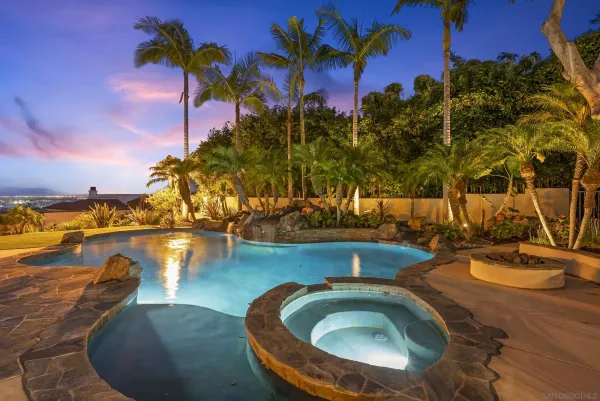 a view of a swimming pool with a patio