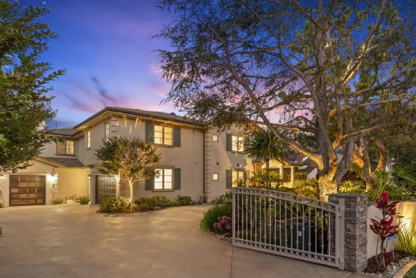 a view of a house with a tree