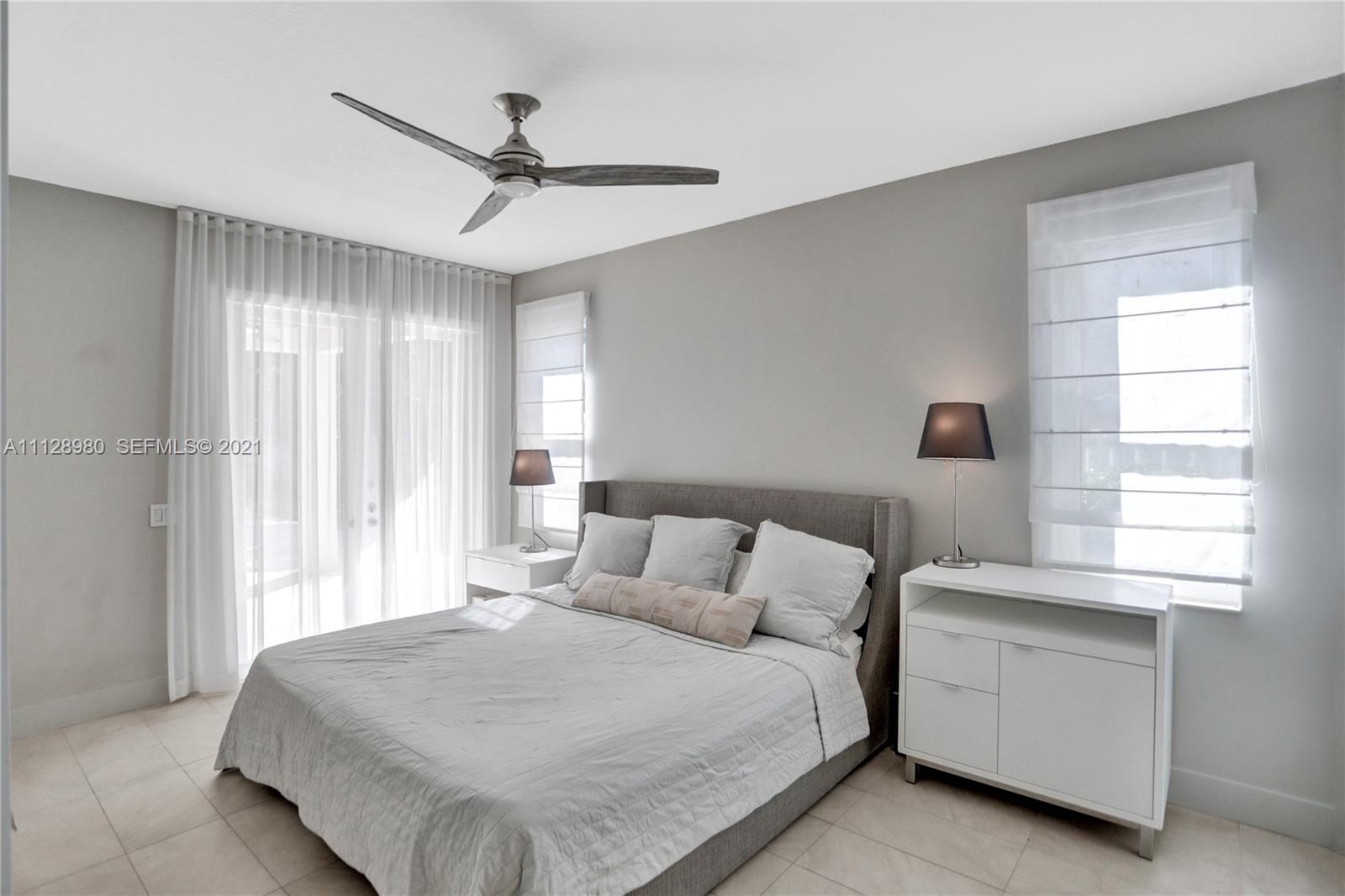 1078 Briar Ridge Road Weston, FL 33327 - Photo 21 of 41 a bedroom with a bed and a window