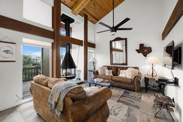 a living room with furniture fireplace and a flat screen tv