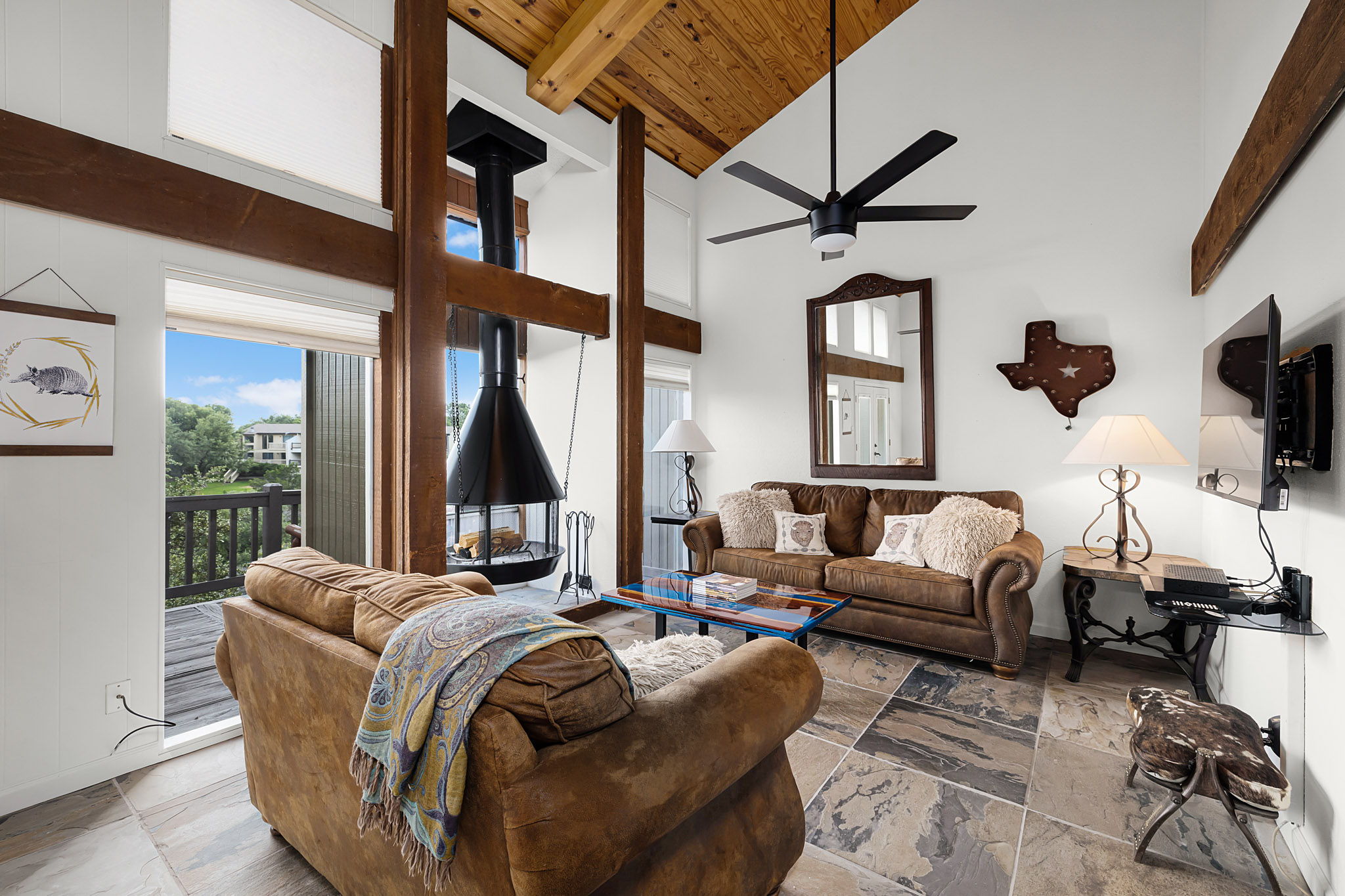 229 Comanche Lane Point Venture, TX 78645 - Photo 13 of 38 a living room with furniture fireplace and a flat screen tv