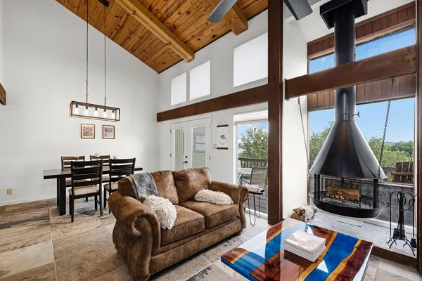 a living room with furniture a rug and a window