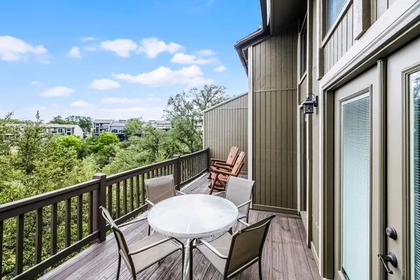 a view of a balcony with furniture