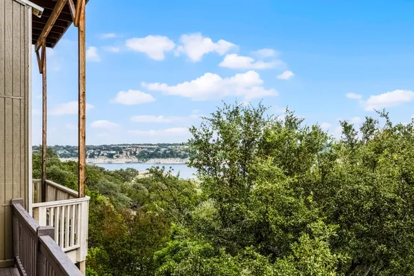 a view of a balcony next to a lake view