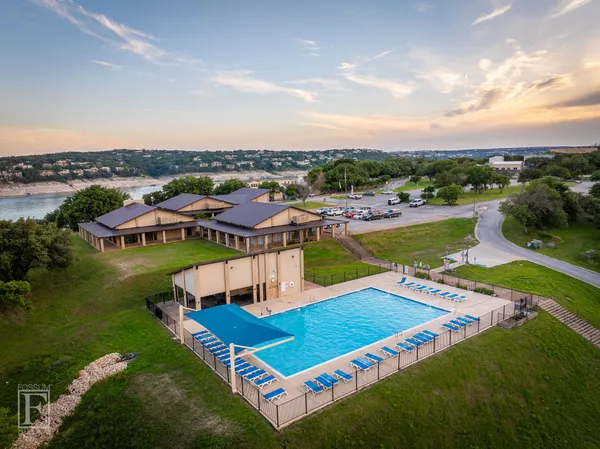 an aerial view of a house with pool ocean view