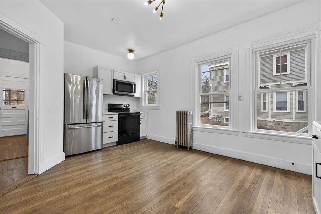 a kitchen with stainless steel appliances a refrigerator and a stove top oven