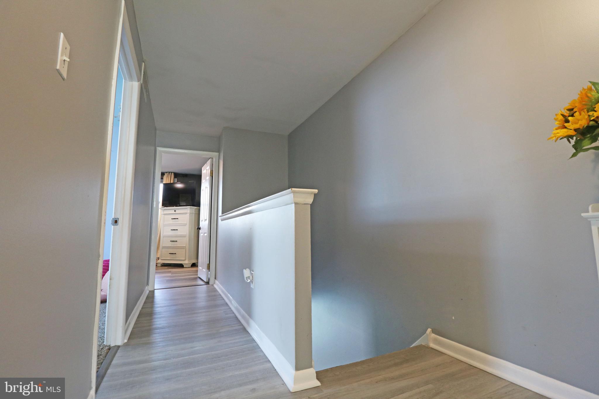 212 Riverview Avenue Ridley Park, PA 19078 - Photo 14 of 45 a view of a hallway with wooden floor