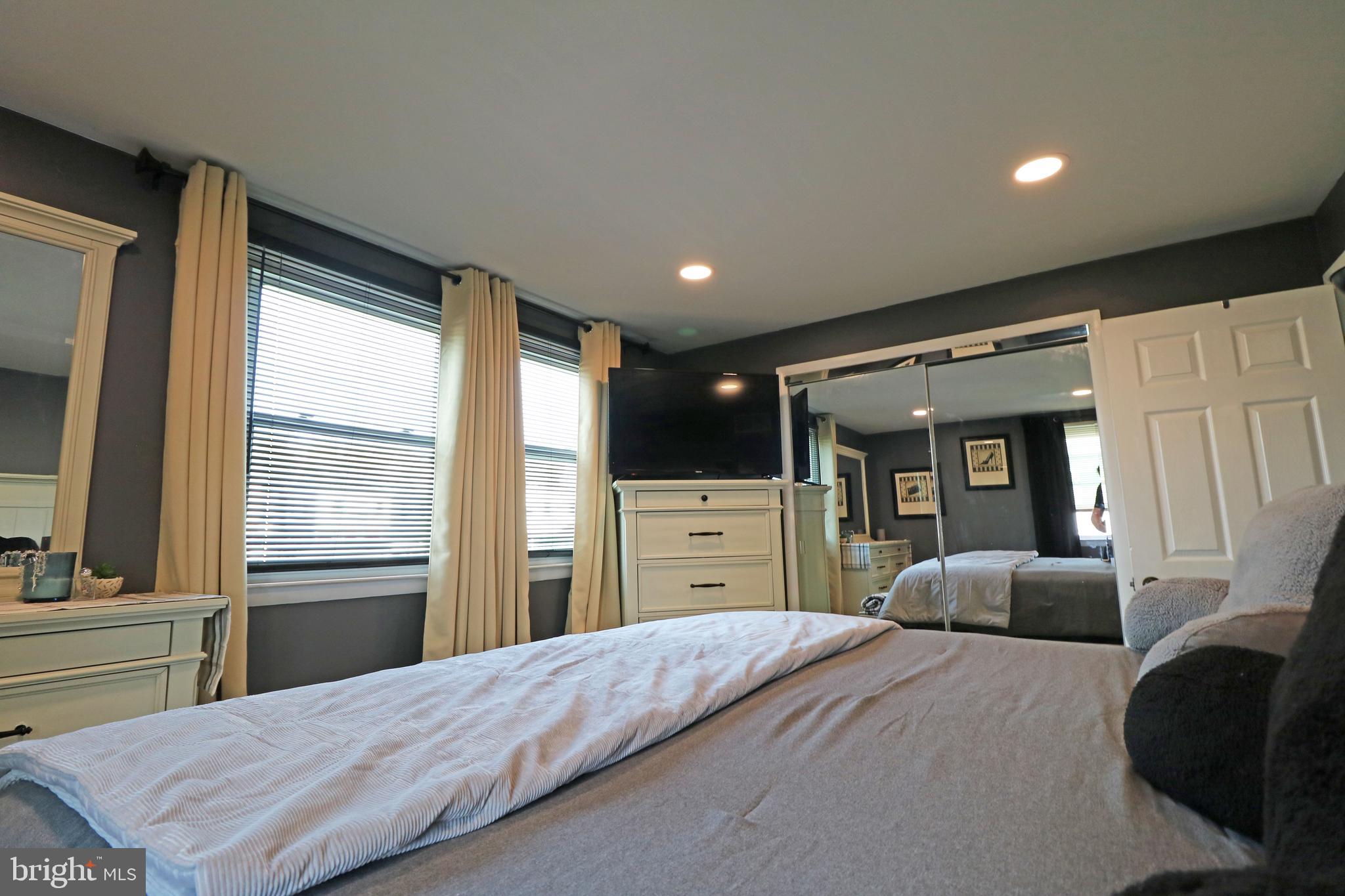 212 Riverview Avenue Ridley Park, PA 19078 - Photo 16 of 45 a bedroom with a bed and a large window