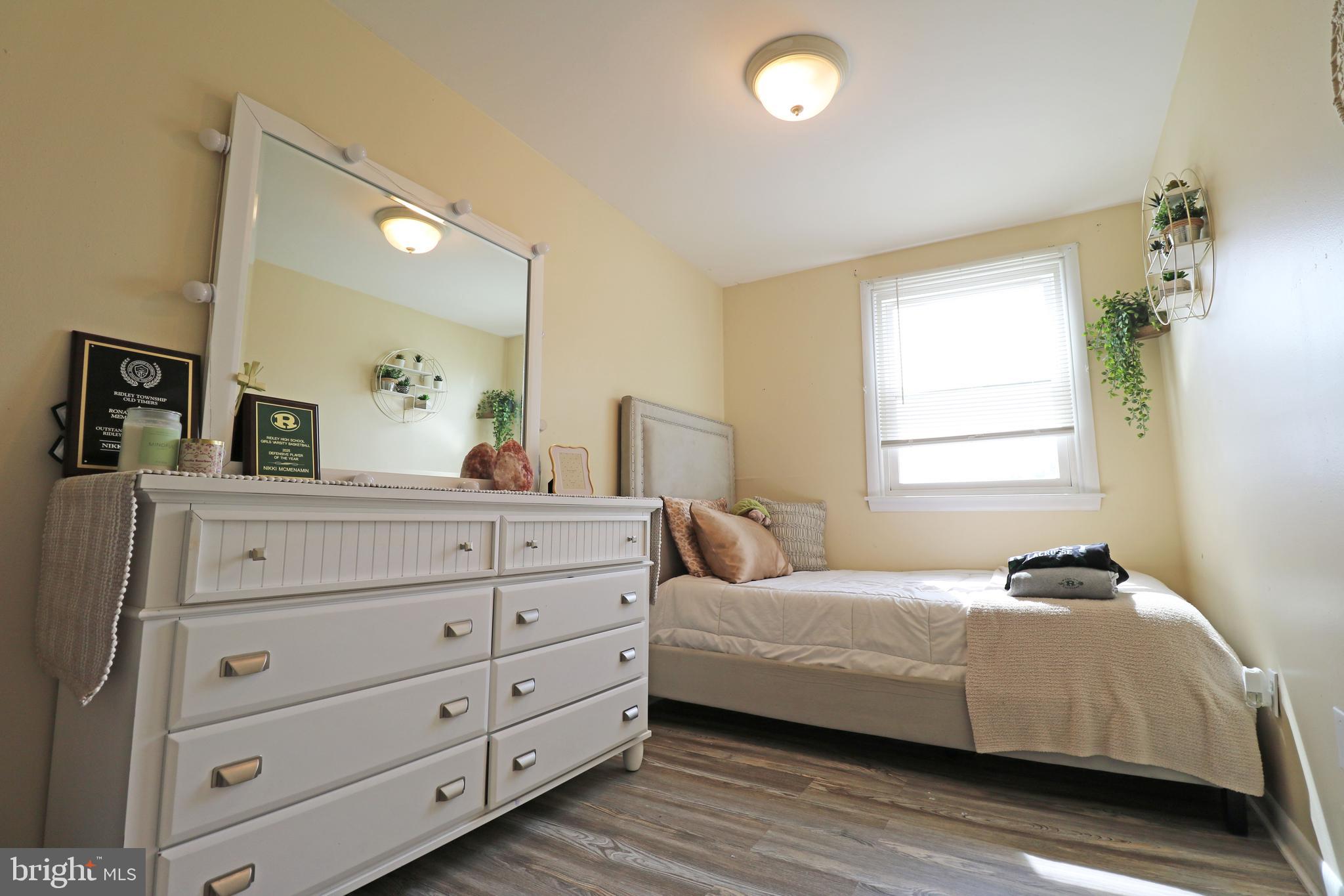 212 Riverview Avenue Ridley Park, PA 19078 - Photo 20 of 45 a bedroom with a bed and a mirror on dresser