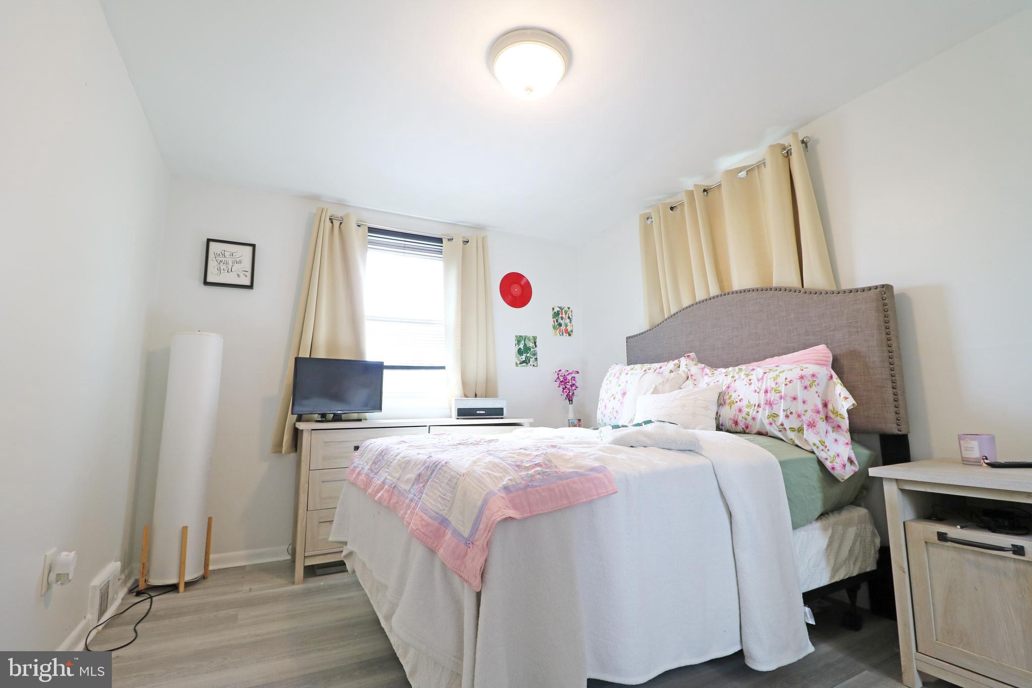 212 Riverview Avenue Ridley Park, PA 19078 - Photo 21 of 45 a bedroom with a bed and a potted plant