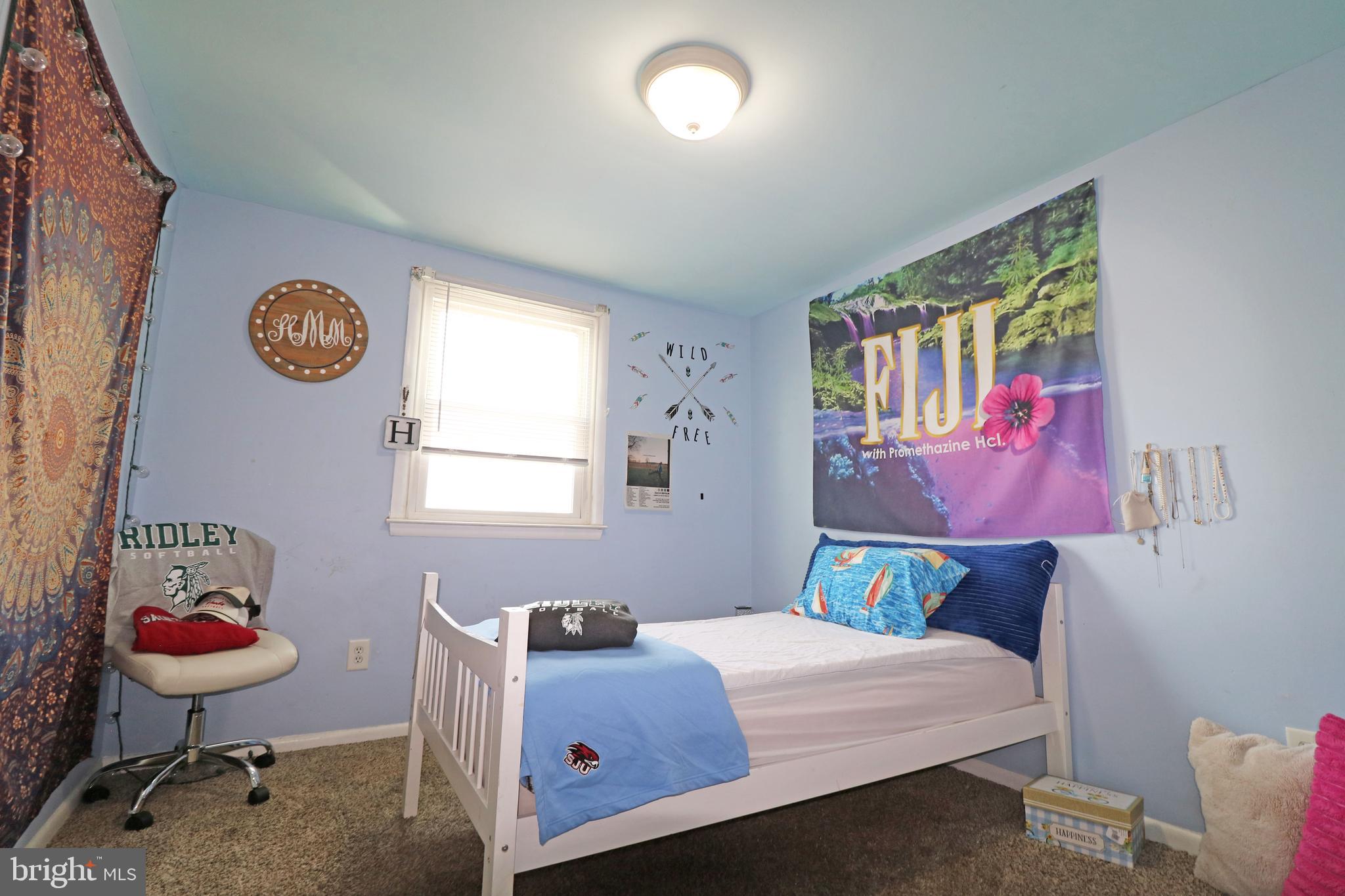212 Riverview Avenue Ridley Park, PA 19078 - Photo 23 of 45 a bedroom with a bed and a table