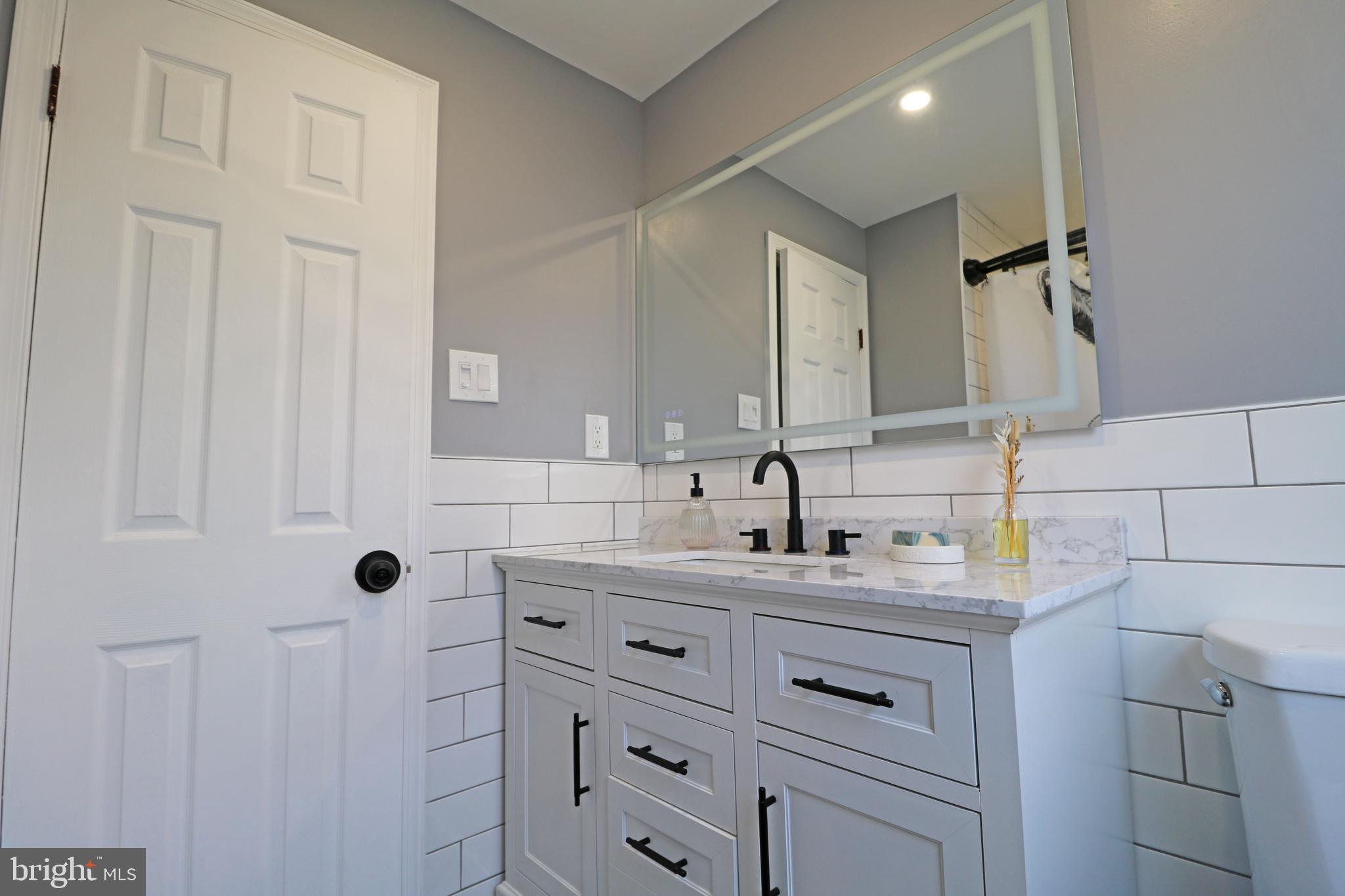 212 Riverview Avenue Ridley Park, PA 19078 - Photo 27 of 45 a bathroom with a sink and a mirror