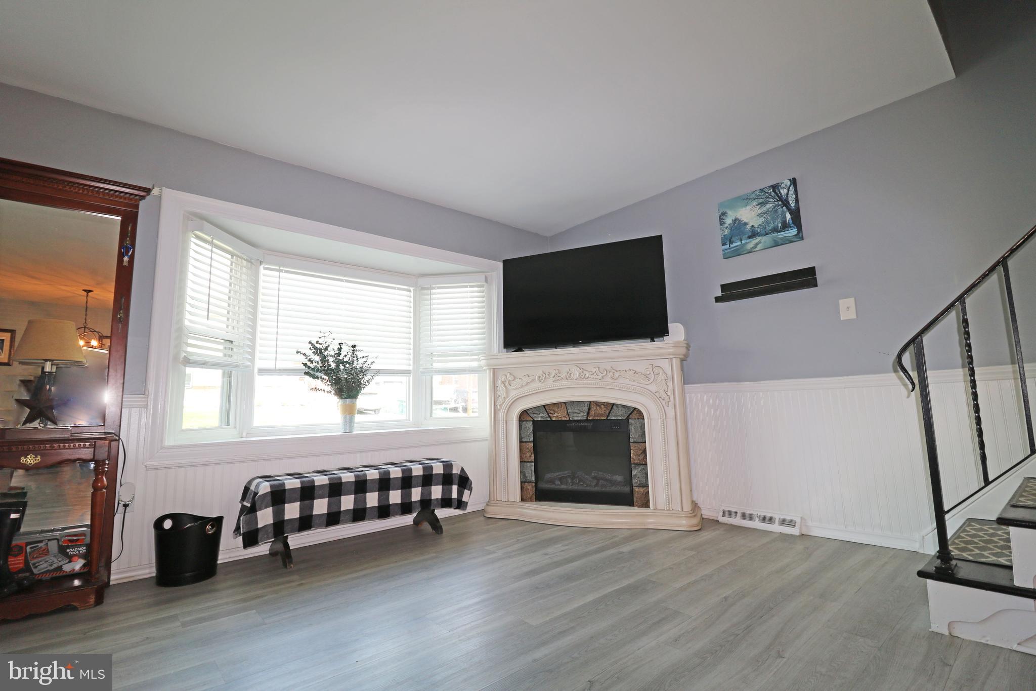 212 Riverview Avenue Ridley Park, PA 19078 - Photo 4 of 45 a view of livingroom with furniture a fireplace and wooden floor