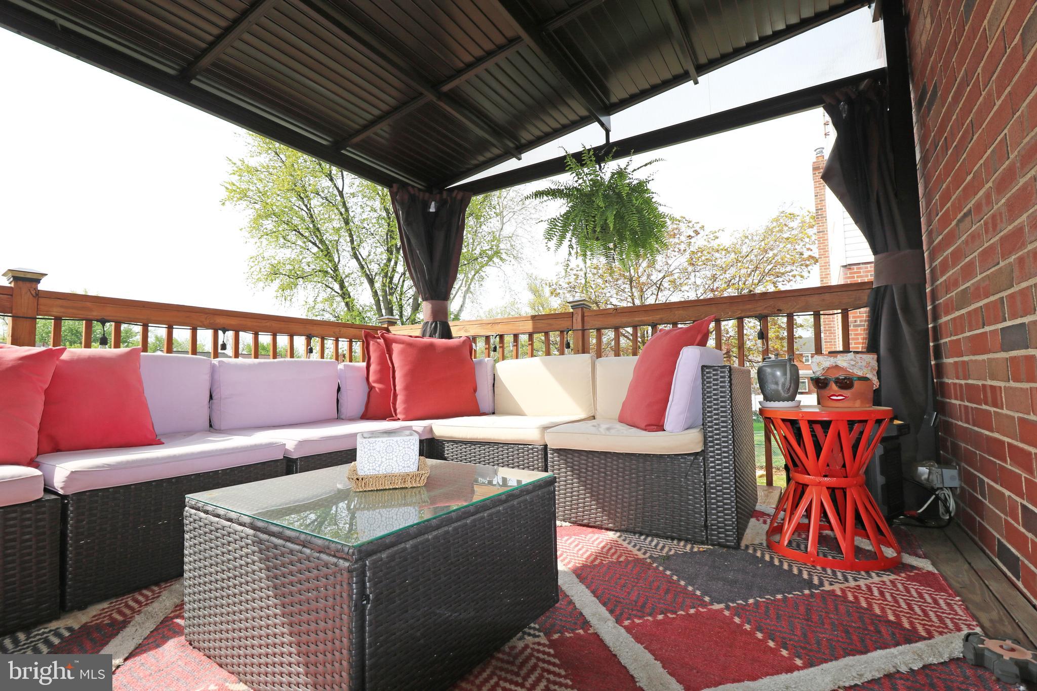 212 Riverview Avenue Ridley Park, PA 19078 - Photo 41 of 45 a outdoor sitting area with furniture and wooden floor