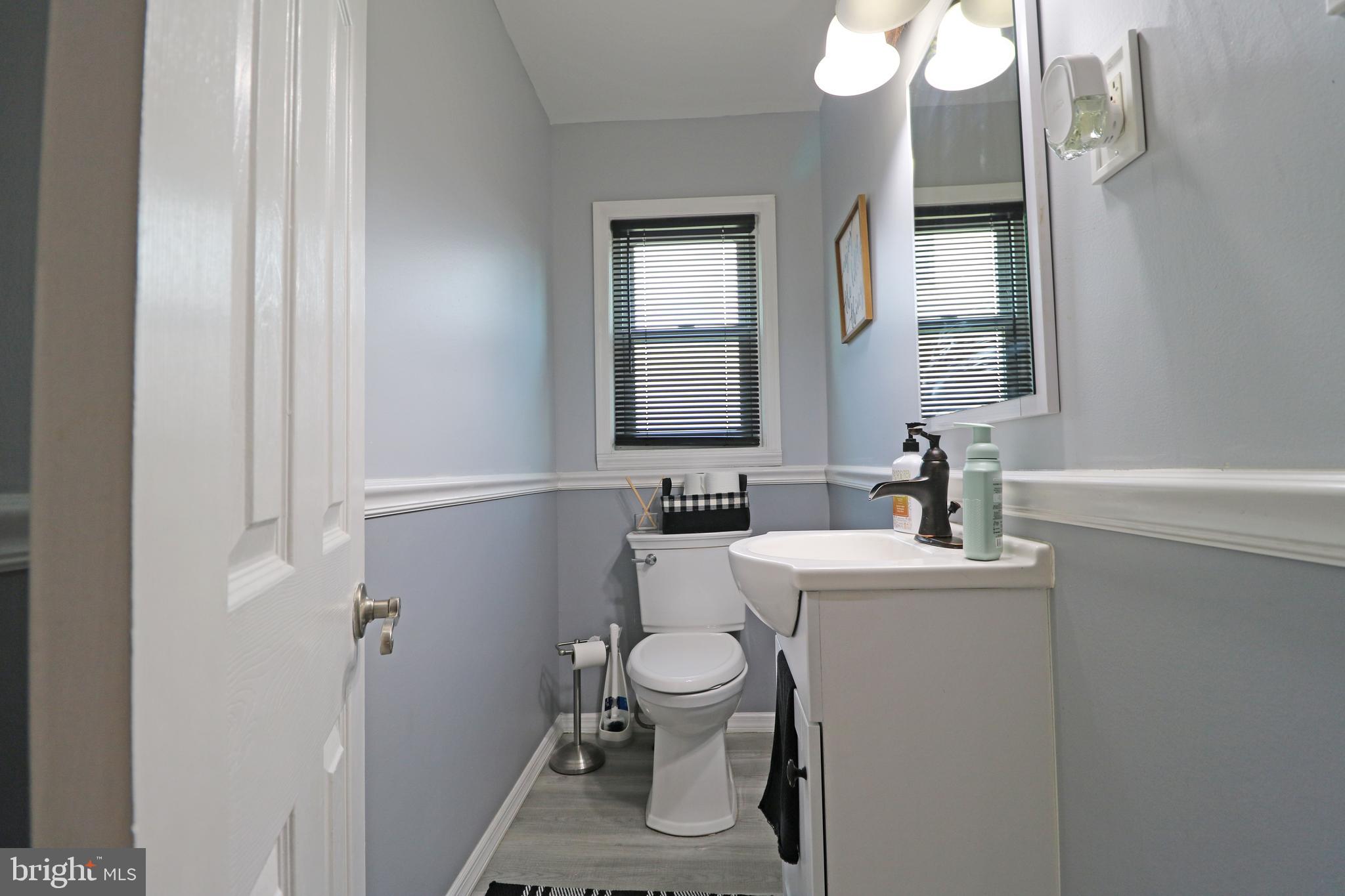 212 Riverview Avenue Ridley Park, PA 19078 - Photo 9 of 45 a bathroom with a toilet sink and mirror