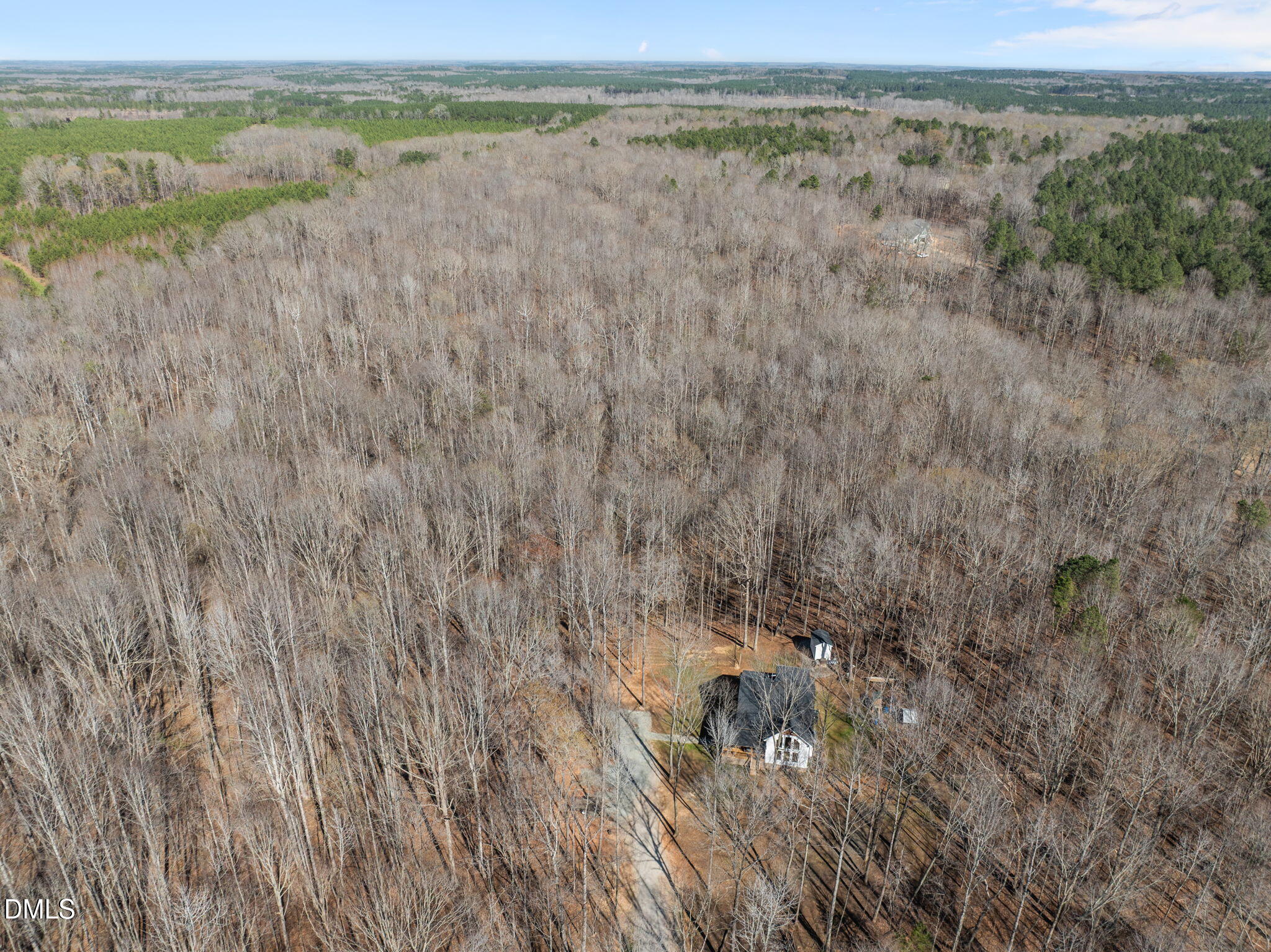 8514 Charlie Stovall Road Roxboro, NC 27574 - Photo 2 of 48 a view of a yard with an ocean beach