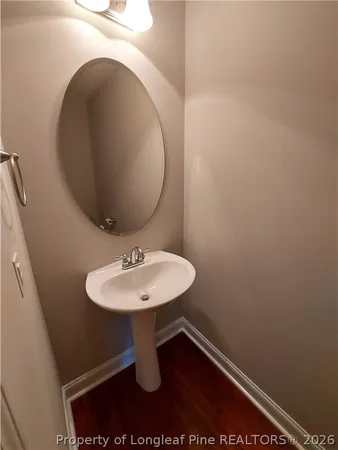 a bathroom with a sink and mirror