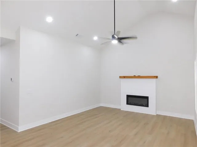 a view of an empty room with a fireplace