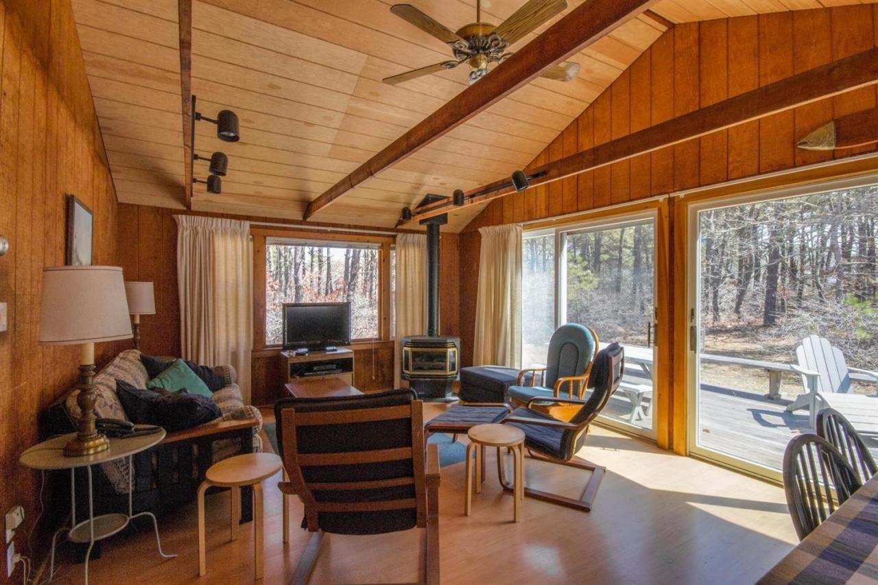 20 Litchfield Road Edgartown, MA 02539 - Photo 20 of 29 a living room with furniture a flat screen tv and floor to ceiling window