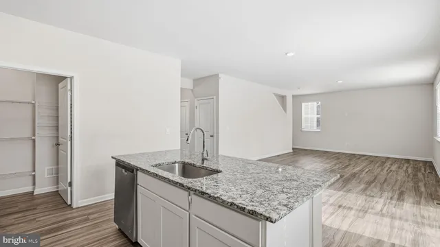 a kitchen with sink and window