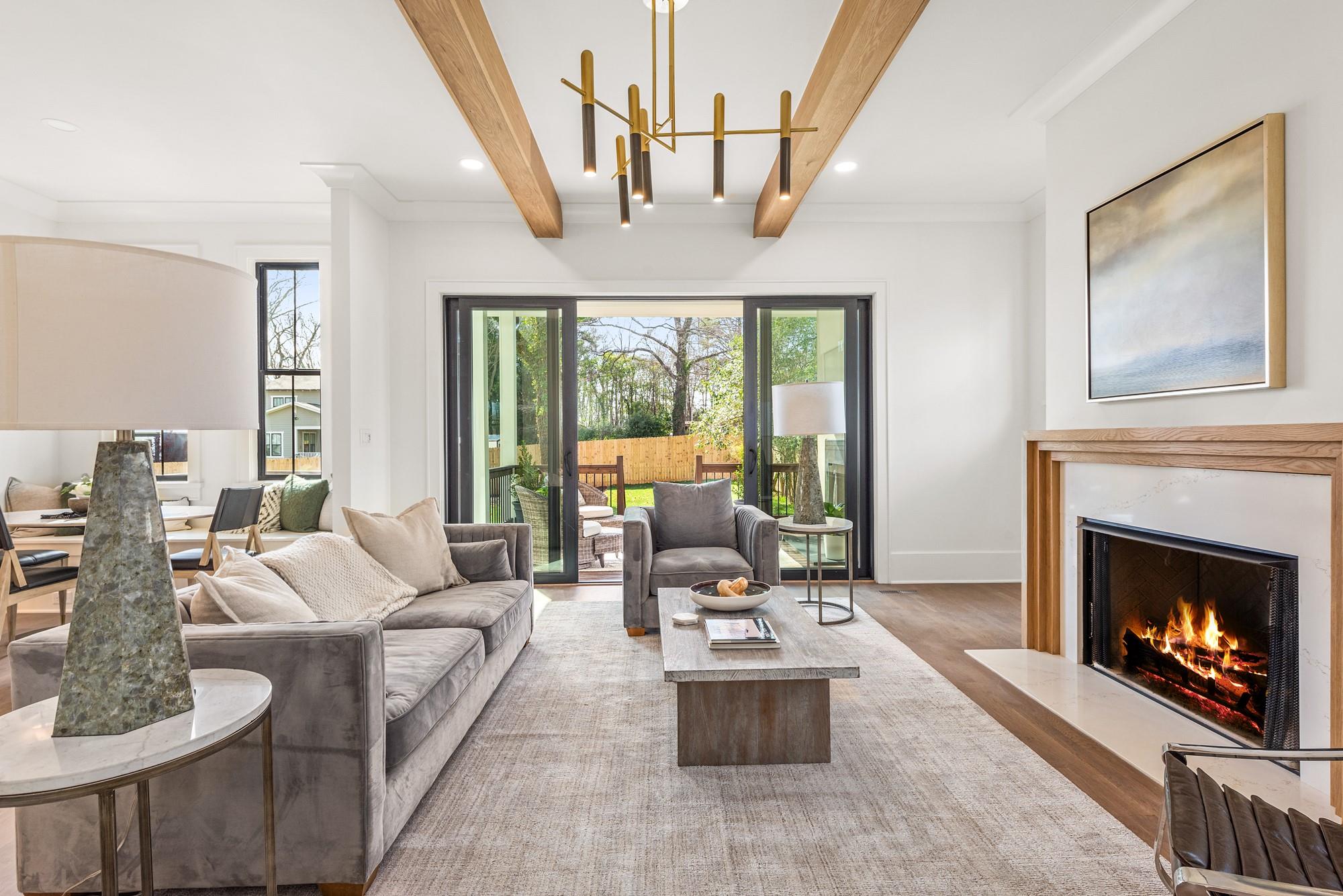 4324 Walker Road Charlotte, NC 28211 - Photo 14 of 44 a living room with furniture a fireplace and a large window