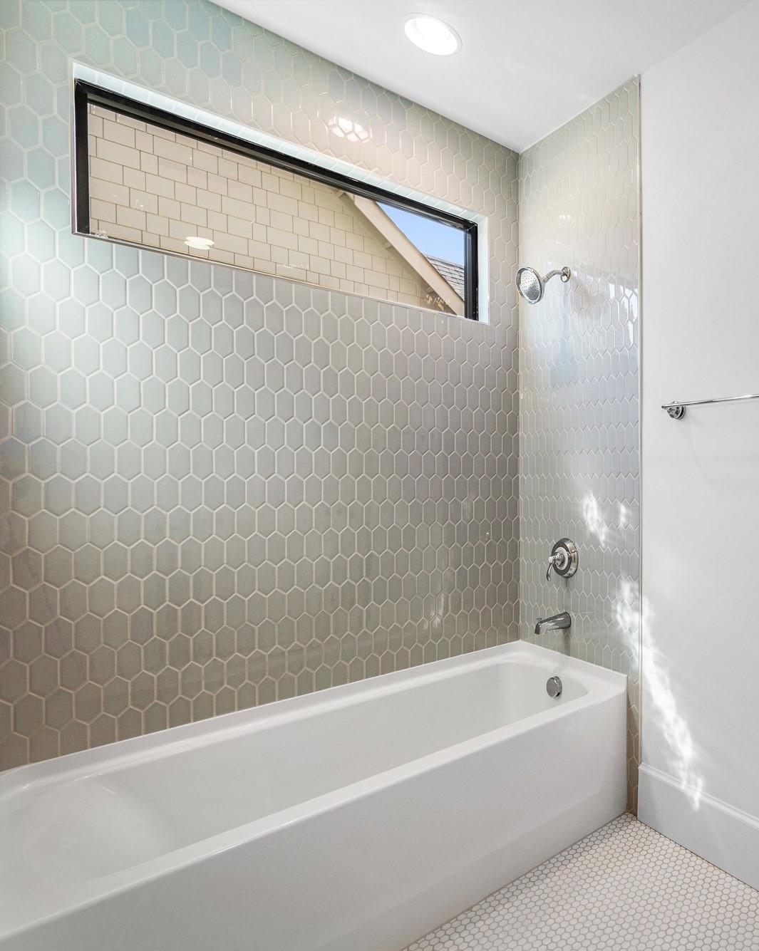 4324 Walker Road Charlotte, NC 28211 - Photo 28 of 44 a bathroom with a bathtub and a shower