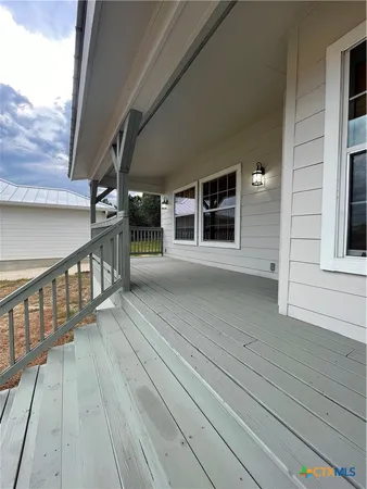 a view of a balcony with car parked