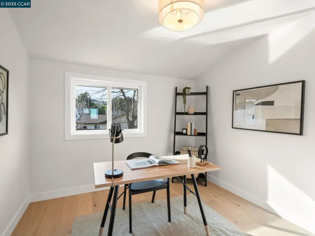 a view of a room with racks on the wall and a window