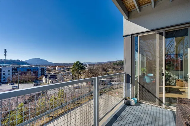 a view of a balcony with wooden floor