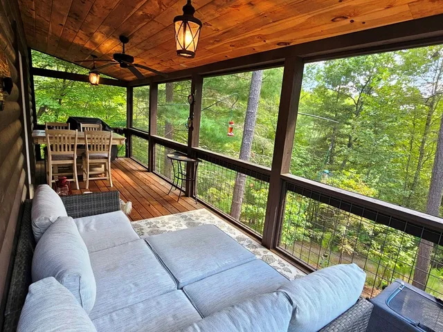 a balcony with furniture and city view