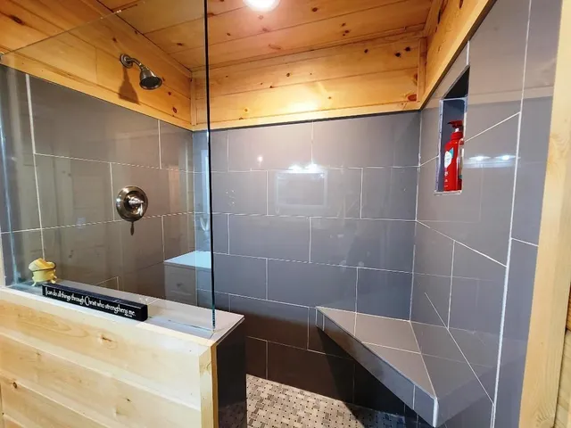 a bathroom with a shower and a sink