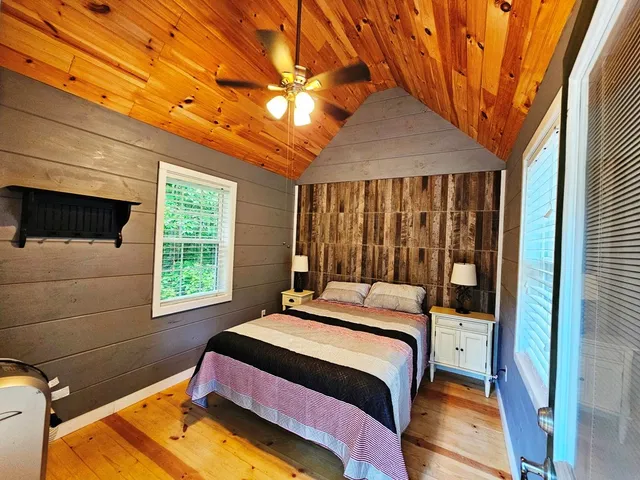 a bedroom with a bed and a window